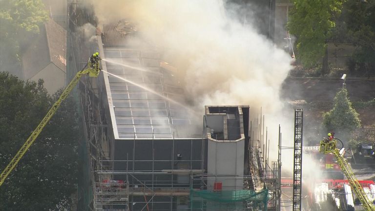 Even though the fire was slowly brought under control, smoke continued to rise into the sky