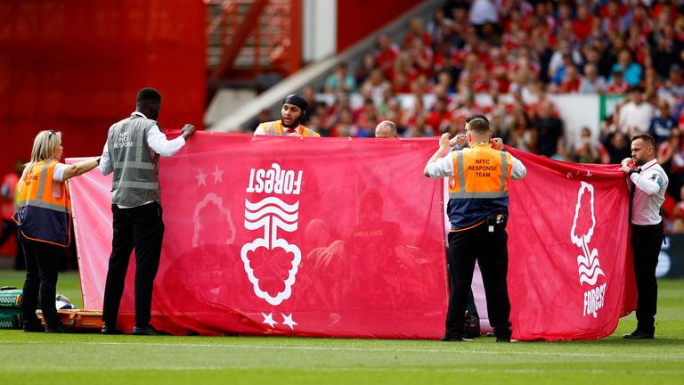 Nottingham Forest's Danilo receives medical attention behind a protective screen. Pic: Action Images via Reuters