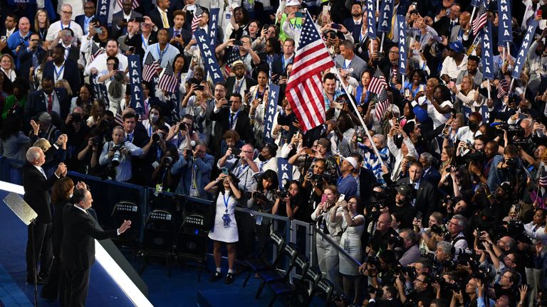 Democratic presidential nominee and U.S. Vice President Kamala Harris celebrates with her husband, second gentleman of the U.S. Doug Emhoff, and vice presidential nominee Minnesota Governor Tim Walz and his wife Gwen, following her acceptance speech on Day 4 of the Democratic National Convention (DNC) at the United Center in Chicago, Illinois, U.S., August 22, 2024. REUTERS/Vincent Alban
