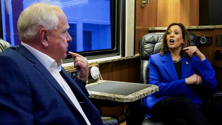 Kamala Harris and her vice presidential candidate Tim Walz on the campaign bus ahead of the Democratic National Convention. Pic: Reuters