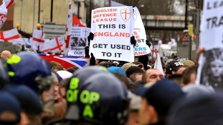 Police watch English Defence League members protesting in St George's Square in Feb 2011