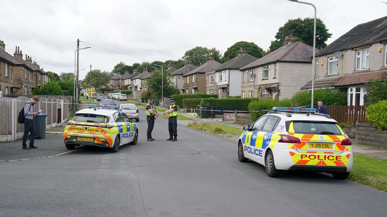 Emergency services on Westbury Road in Bradford after a house fire that killed four people, including three children. Image: PA