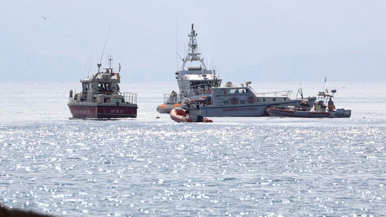 Rescue workers work near the scene where a yacht sank in the early hours of Monday off the coast of Porticello, near the Sicilian city of Palermo, Italy, August 19, 2024. REUTERS/Igor Petyx