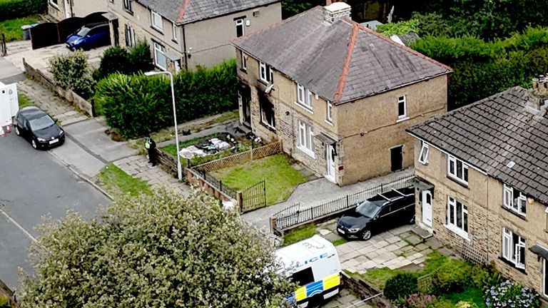 Emergency services on Westbury Road in Bradford after a house fire that killed four people, including three children. Image: PA