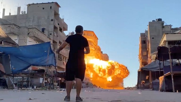 Flames rise following an Israeli strike on a residential building, amid the ongoing conflict between Israel and Hamas, in Gaza City, in this screen grab taken from a video, August 11, 2024. Reuters TV via REUTERS