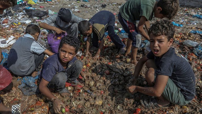 Palestinian children search for food in Deir al-Balah. Pic: AP