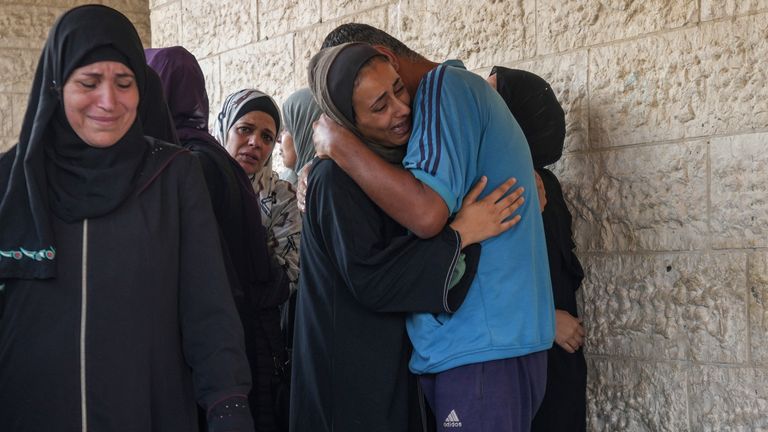 Palestinians grieve after at least 18 killed in an Israeli strike. Pic: AP