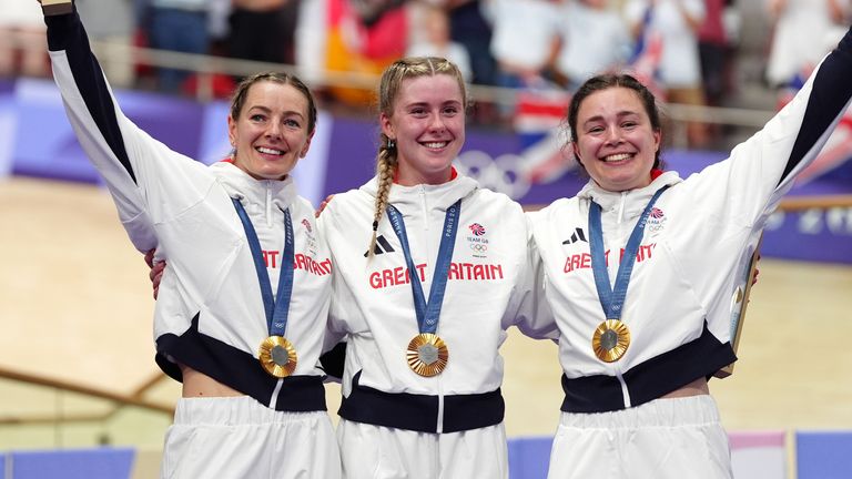 Great Britain's Katy Marchant, Emma Finucane and Sophie Capewell celebrate with their gold medals won in the Women's Team Sprint finals