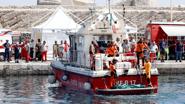 Rescue personnel transport what is believed to be the body of Hannah Lynch.
Pic: Reuters