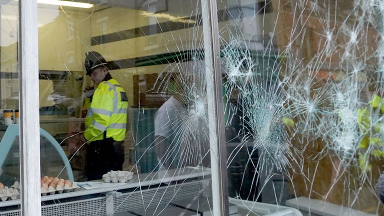 Damage to the window of a butcher's shop on Murray Street in Hartlepool.  Photo::PA