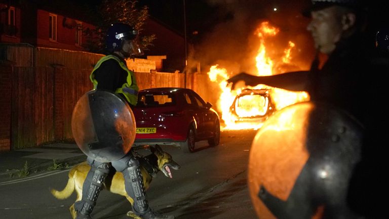 A police car burns as officers are deployed on the streets of Hartlepool.
Pic: PA