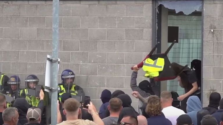 Protester throws chair at police officer outside hotel in Rotherham