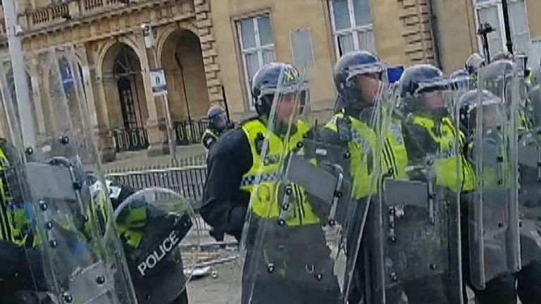 Riot police defend a hotel housing migrants in Hull during the disorder this month