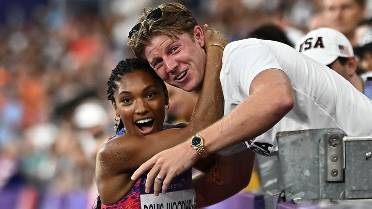 Tara Davis-Woodhall celebrates with husband Hunter Woodhall after her long jump gold win. Pic: Reuters