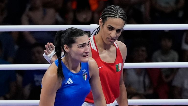 Algeria&#39;s Imane Khelif, red, next to Italy&#39;s Angela Carini, at the end of their women&#39;s 66kg preliminary boxing match at the 2024 Summer Olympics, Thursday, Aug. 1, 2024, in Paris, France. (AP Photo/John Locher)