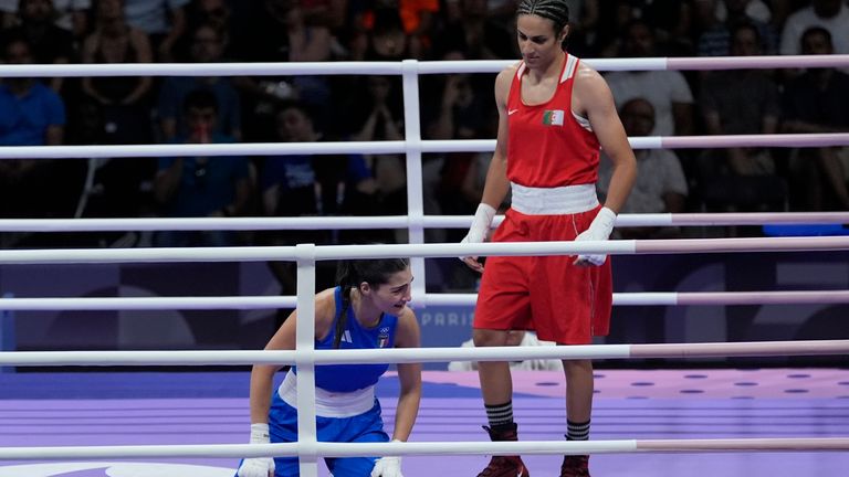 Algeria's Imane Khelif, right, defeated, Italy's Angela Carini in their women's 66kg preliminary boxing match at the 2024 Summer Olympics, Thursday, Aug. 1, 2024, in Paris, France. (AP Photo/John Locher)