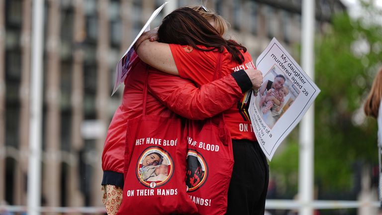 Infected blood campaigners hugging ahead of the publication of the final report into the scandal