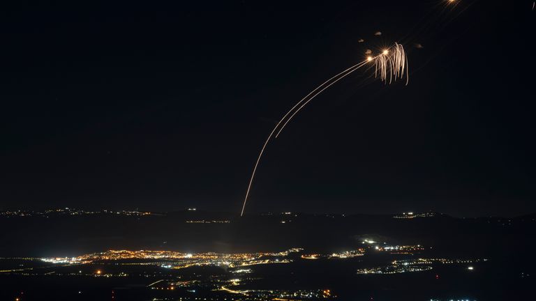 The Israeli Iron Dome air defence system fires to intercept an attack from Lebanon over the Galilee region. Pic: AP