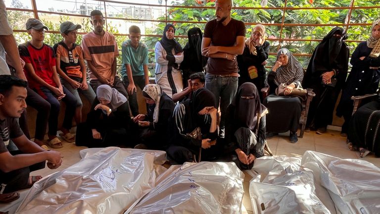 Mourners next to the bodies of Palestinians killed in Israeli strikes at the Nasser Hospital. Pic: Reuters