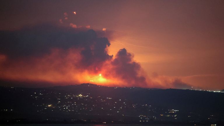 An image shows smoke and fire on the Lebanese side of the border with Israel after Israel said it spotted the armed group Hezbollah preparing to attack Israel and carried out pre-emptive strikes on Hezbollah targets in Lebanon, seen from Tyre, southern Lebanon, August 25, 2024. REUTERS/Aziz Taher