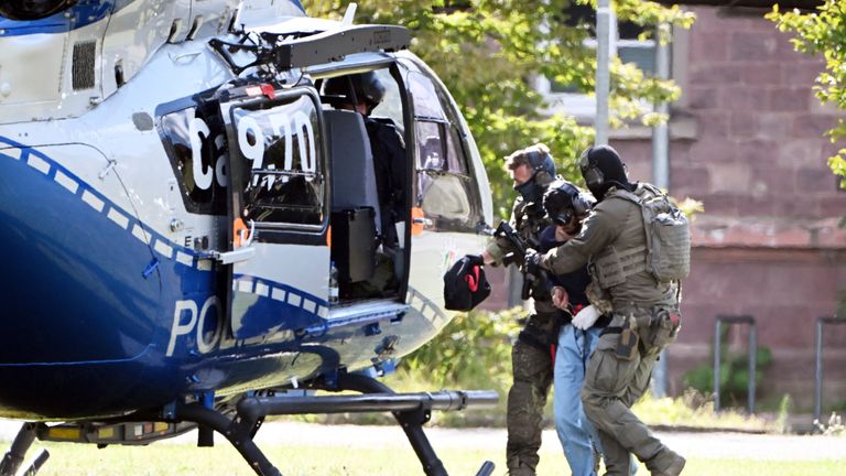 Suspect being transported by helicopter after appearing in court on Sunday. Pic: Uli Deck/picture-alliance/dpa/AP