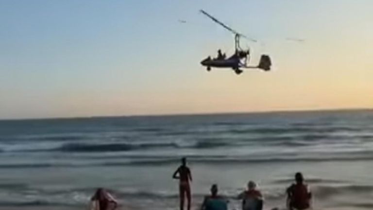 Aircraft crashes near swimmers on beach