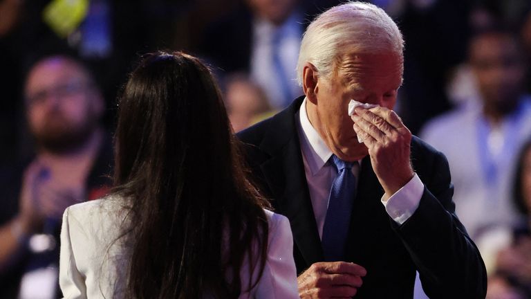 Joe Biden wipes away a tear as he takes to the stage. Pic: Reuters