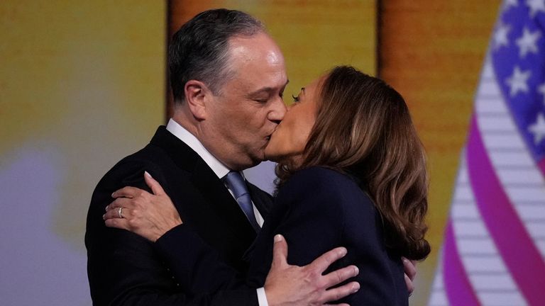 Democratic presidential nominee Vice President Kamala Harris kisses Second gentleman Douglas Emhoff after the nomination during the Democratic National Convention Thursday, Aug. 22, 2024, in Chicago. (AP Photo/Brynn Anderson)