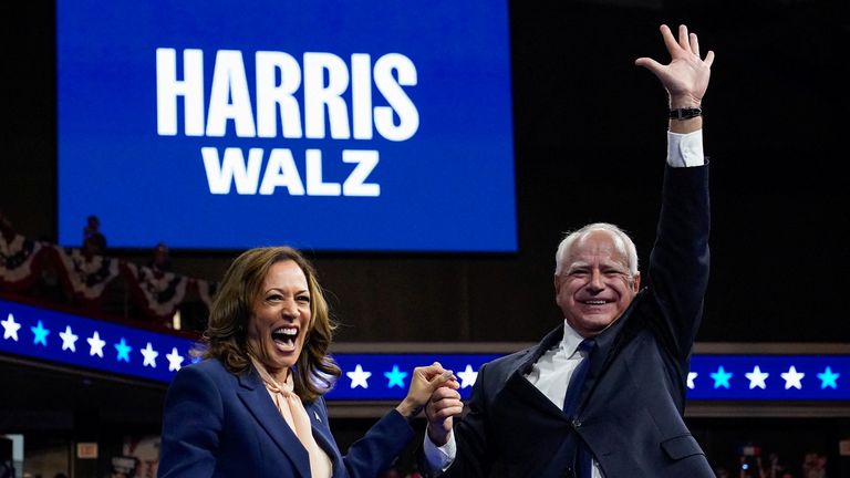 U.S. Vice President and Democratic presidential candidate Kamala Harris and her newly chosen vice presidential running mate Minnesota Governor Tim Walz react as they hold a campaign rally in Philadelphia, Pennsylvania, U.S., August 6, 2024. REUTERS/Elizabeth Frantz