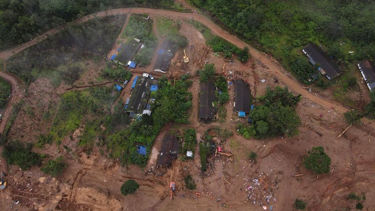 A drone view shows rescuers searching for survivors amidst debris of damaged houses after multiple landslides in the hills in Wayanad district, in the southern state of Kerala, India, August 1, 2024. REUTERS