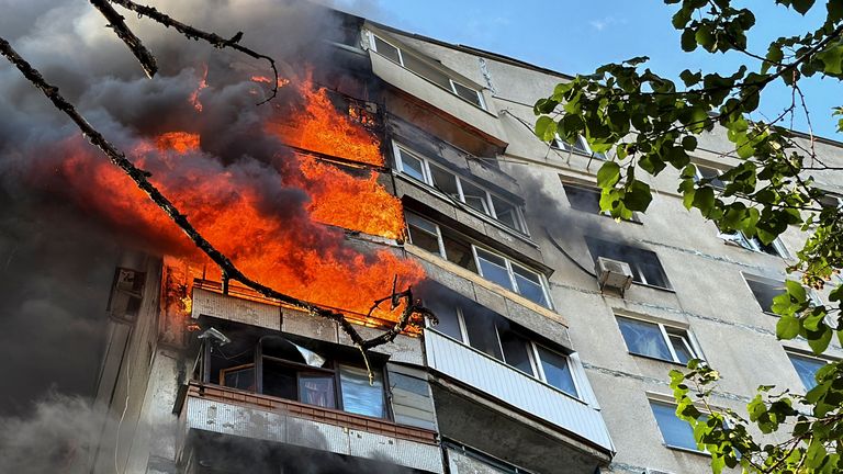 An apartment building burns after a Russian air strike in Kharkiv.
Pic: Reuters