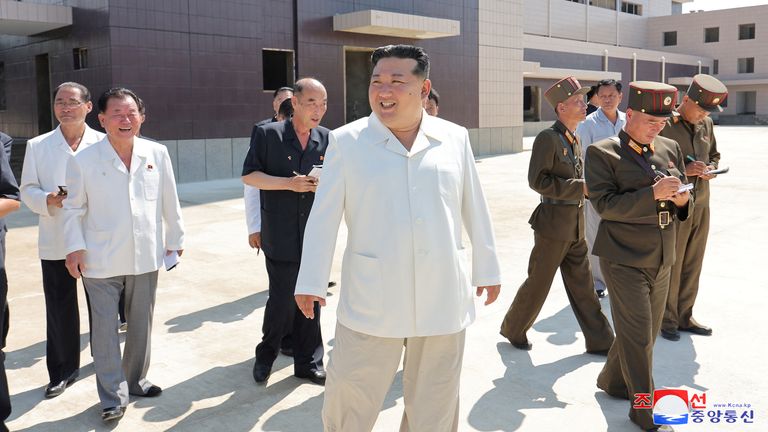 Kim Jong Un smiles while on a visit to the construction site.
Pic KCNA/Reuters