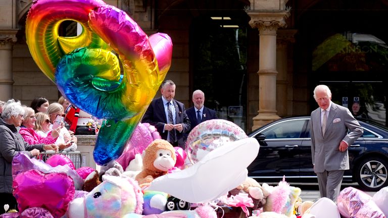 King Charles views the tributes outside the Atkinson Art Centre in Southport.
Pic: PA