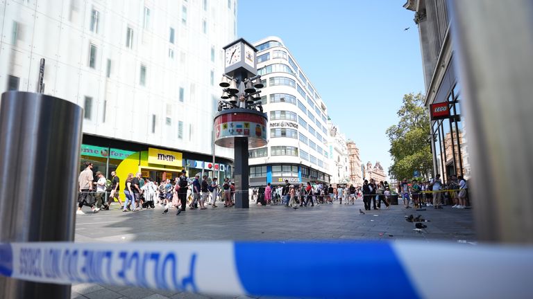 Police officers at the scene in Leicester Square.
Pic: PA