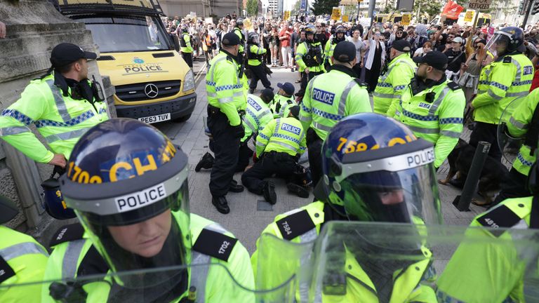 Police restrain a man during a protest in Liverpool, following the stabbing attacks on Monday in Southport, in which three young children were killed. Picture date: Saturday August 3, 2024.  