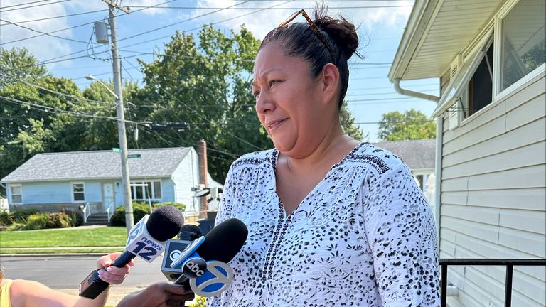 A neighbor, Randy Marquis, speaks to reporters in Syosset, N.Y., Monday,. Aug. 26, 2024. Marquis lives across the street from the house where a man shot and killed four of his family members before turning the gun on himself on Sunday. (AP Photo/Philip Marcelo)


