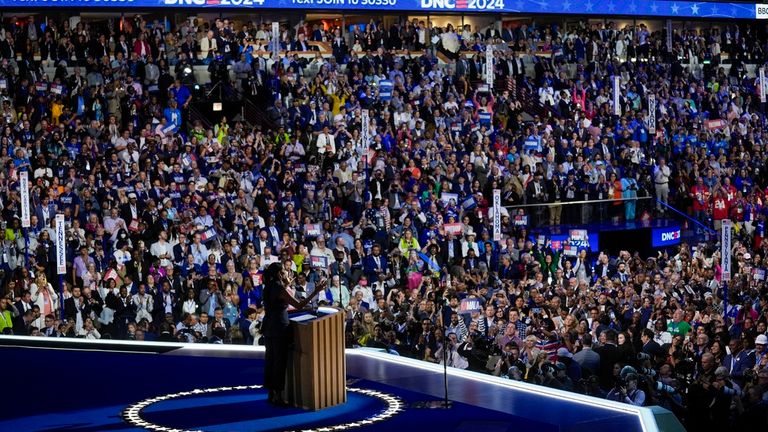 Michelle Obama addresses the crowd. Pic: AP