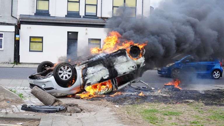 A car after it was flipped over and set on fire by rioters in Middlesbrough on Sunday 4 August. Pic: PA