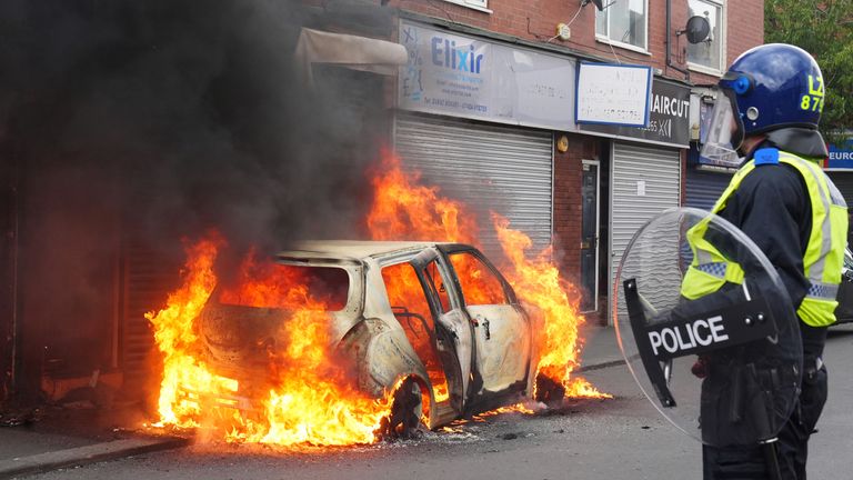 A car after it was set on fire by protesters in Middlesbrough on Sunday 4 August.  Photo: PA