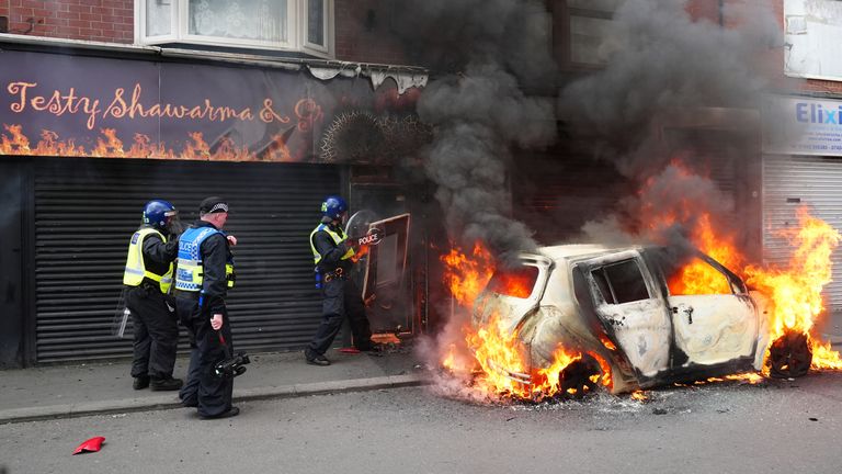 A car burns on Parliament Road, in Middlesbrough, during an anti-immigration protest. Picture date: Sunday August 4, 2024. eiqkiqtxitqinv