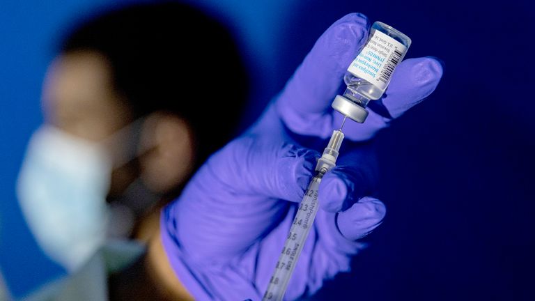 FILE - A family nurse practitioner prepares a syringe with the Mpox vaccine for inoculating a patient at a vaccination site in the Brooklyn borough of New York, on Tuesday, Aug. 30, 2022. Gay and bisexual men at high risk for mpox infection should get vaccinated for the virus even after the current outbreak ends, government health advisers said Wednesday, Oct. 25, 2023. (AP Photo/Jeenah Moon, File)