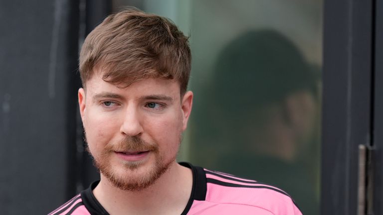 Jimmy Donaldson, the popular YouTube video maker who goes by MrBeast, wears a Lionel Messi jersey as he stands in a sideline box at the start of an MLS soccer match between Inter Miami and CF Montreal Sunday, March 10, 2024, in Fort Lauderdale, Fla. (AP Photo/Rebecca Blackwell)