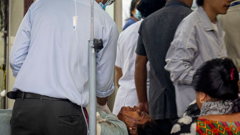 An injured woman is brought for treatment at a hospital, after a bus carrying Indian tourists fell into a river near Abukhaireni town about 75 miles west of the capital Kathmandu, Nepal, Friday, Aug. 23, 2024. (AP Photo/Niranjan Shrestha)