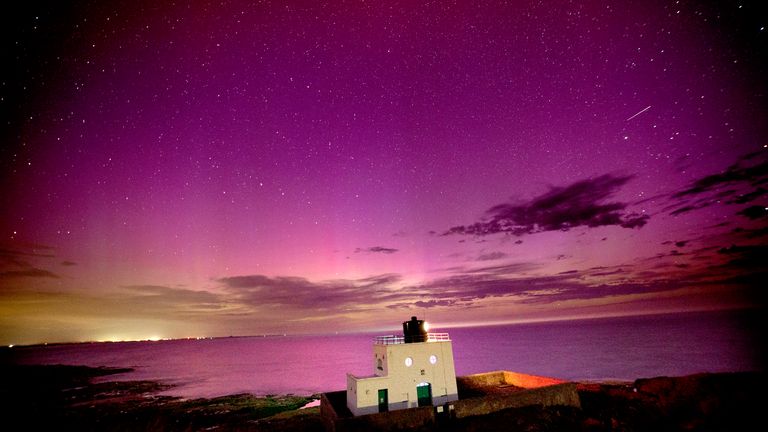 The aurora borealis, also known as the northern lights, appears over Bamburgh Lighthouse, in Northumberland.
Pic: PA