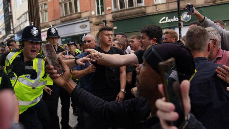 Police officers face protesters in Nottingham Market Square following the stabbing attacks on Monday in Southport, in which three young children were killed. Picture date: Saturday August 3, 2024.

