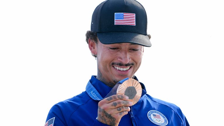  Nyjah Huston looks at his bronze medal. Pic: Reuters