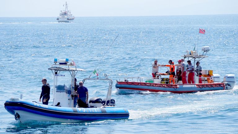 An Italian fire service dive team return to port on the fifth day of the search and recovery operation.
Pic: PA