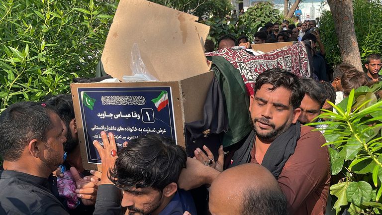 People carry the casket of a Shiite Muslim pilgrim who was killed in the bus crash in Iran while heading to Iraq for a pilgrimage, during a funeral in Larkana, Pakistan, Saturday, Aug. 24, 2024. (AP Photo/Muhammad Usama)