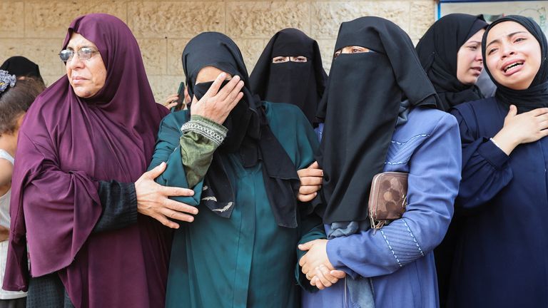 Palestinian women mourn those killed in Israeli strike. Pic: Reuters