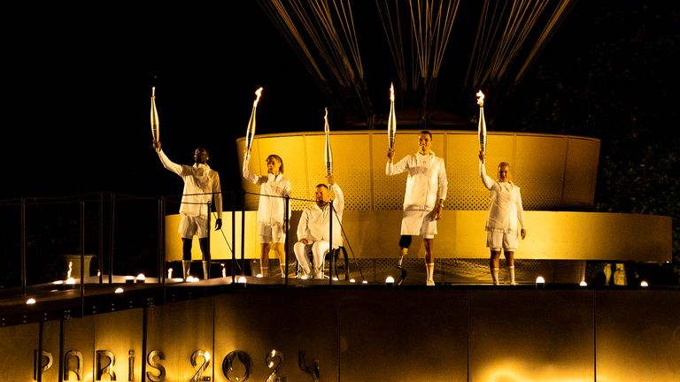 France Paralympic torchbearers, Charles-Antoine Kaoukou, Elodie Lorandi, Fabien Lamirault, Alexis Hanquinquant and Nantenin Keita. Pic: PA